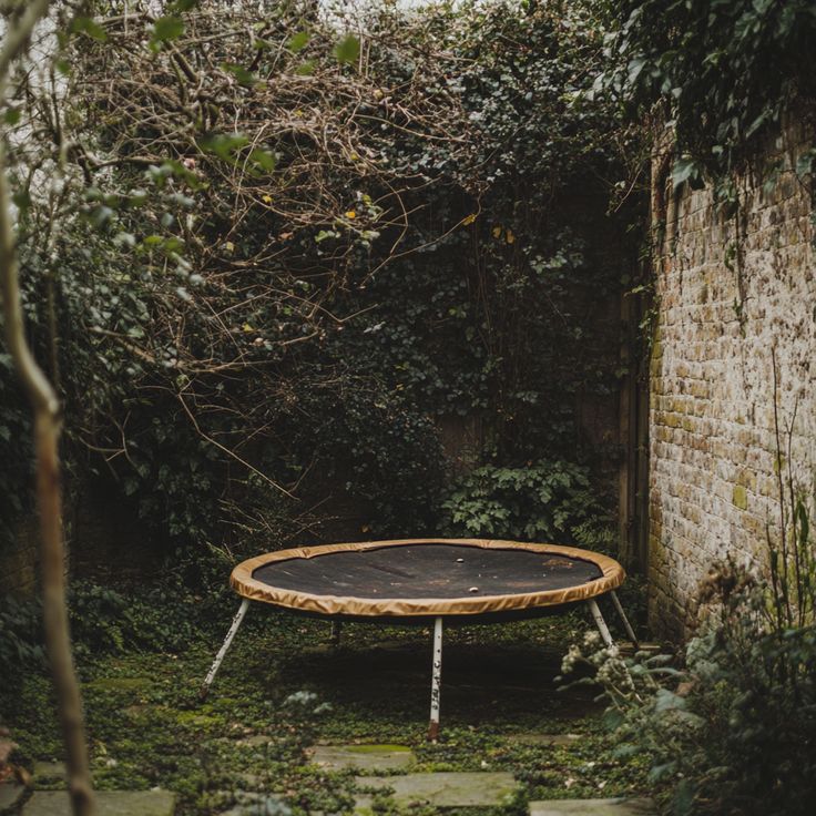 a broken trampoline in a garden